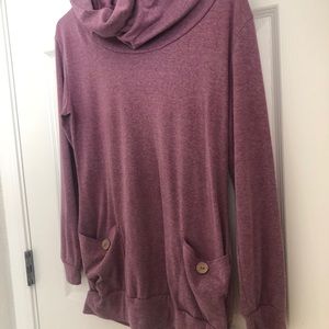 Purple cowl neck sweater.